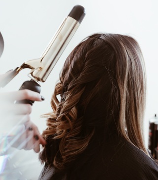 a woman having her hair done at a salon